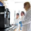 From left: Marianne Ferguson, Grace Reville and Dr. Jochen Nuester wait on an experiment at Bigelow Laboratories on Nov. 8. Reville and Ferguson, along with two other students from Colby College, have been at Bigelow for the fall semester.BEN BULKELEY/Boothbay Register