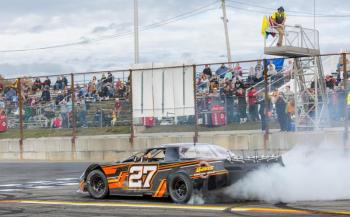 Bubba Pelton does a burnout on the front stretch after winning the feature race and the Super Street championship.  Jasen Dickey Photography