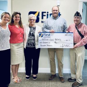Pictured from left are: First National Bank’s Alyssa Allen, Lorna Weber, American Legion Auxiliary’s Sue Burge, First National Bank’s Adam Climo and American Legion Post 36’s Jim Singer presenting American Legion Post 36 with a $1,000 contribution toward their community banners program which honors veterans in the Boothbay region. Courtesy of FNB
Bank donation