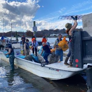 Volunteers unload trash from boats at the Damariscotta town landing following a successful cleanup in 2024. Courtesy of Coastal Rivers Volunteers unload trash from boats at the Damariscotta town landing following a successful cleanup in 2024. Courtesy of Coastal Rivers