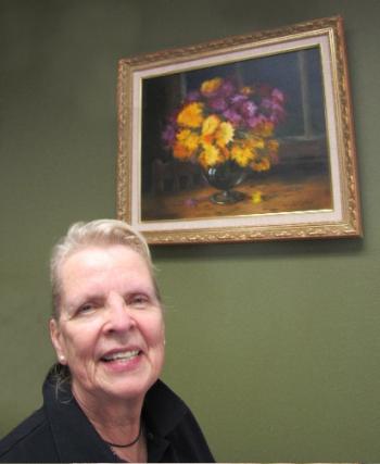 Sue Heil Kibbe with one of her oil paintings. See the whole exhibition at First Federal Savings in Boothbay Harbor through October. 