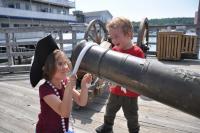Bernadette McKenney, left, and Kolton McKenney take turns sprucing up a cannon in the Whale Park Tuesday morning. Bernadette, 7, and Kolton, 3, were two of the many mini pirates in Boothbay Harbor for the 51st Windjammer Days Festival. BEN BULKELEY/Boothbay Register 